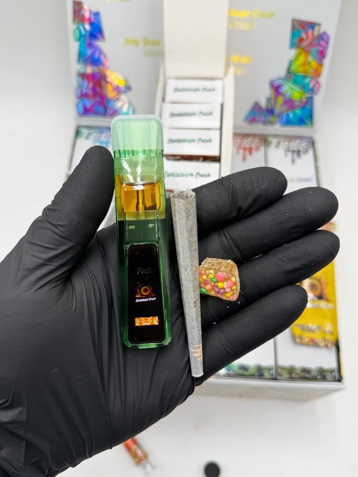 Fade Cantaloupe Crush vape sleeve, gummy pack, and pre-roll tube