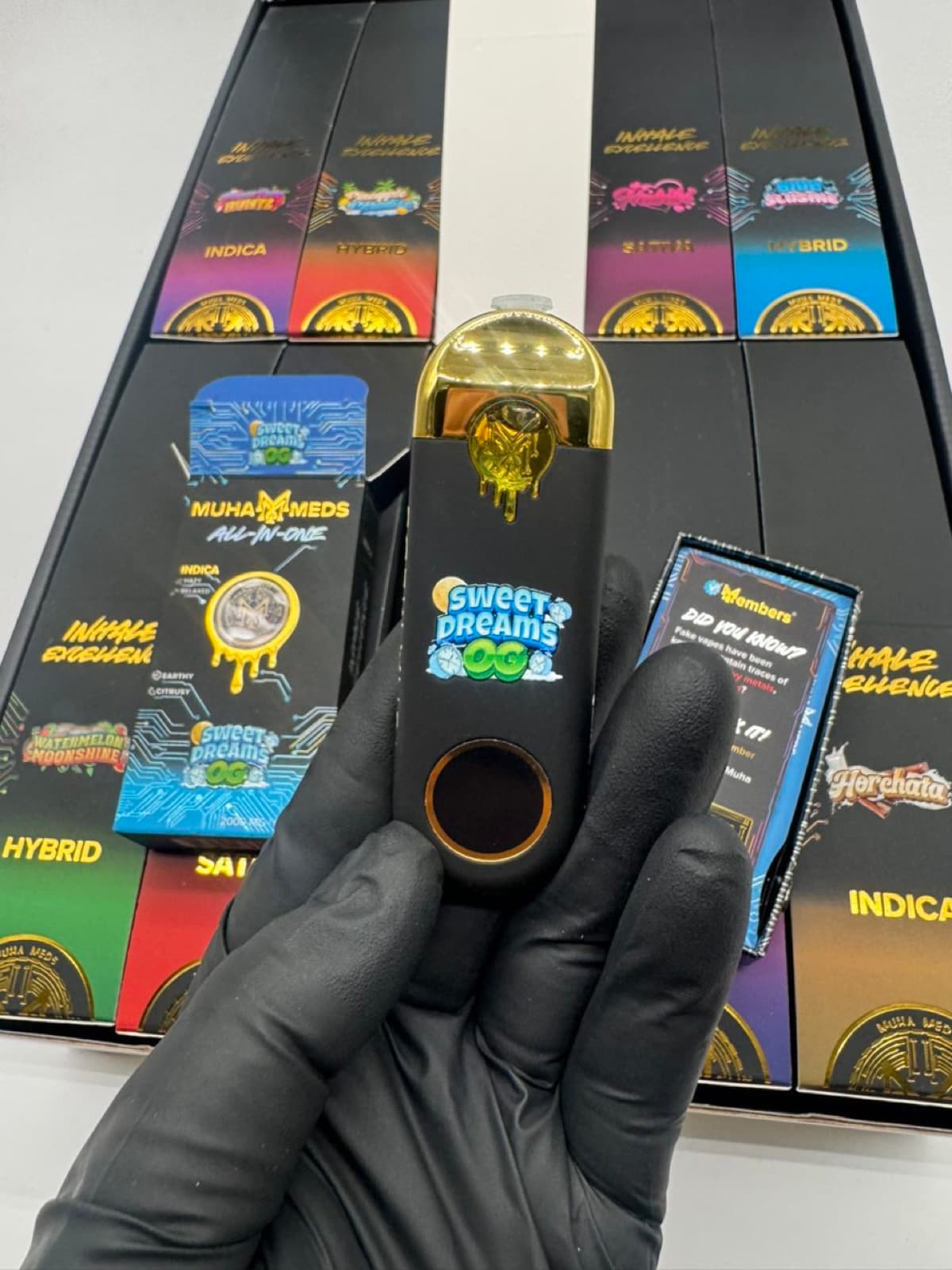 Muha Meds Sweet Dreams OG device with gold cap