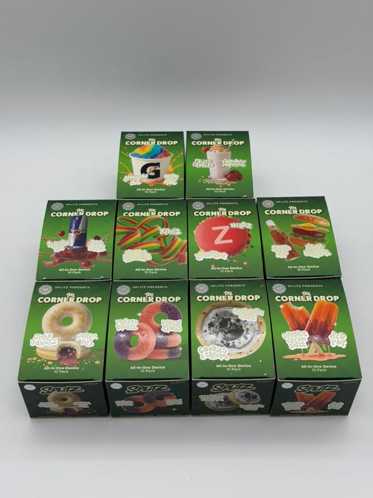 Stack of Corner Drop 10-pack boxes across flavors