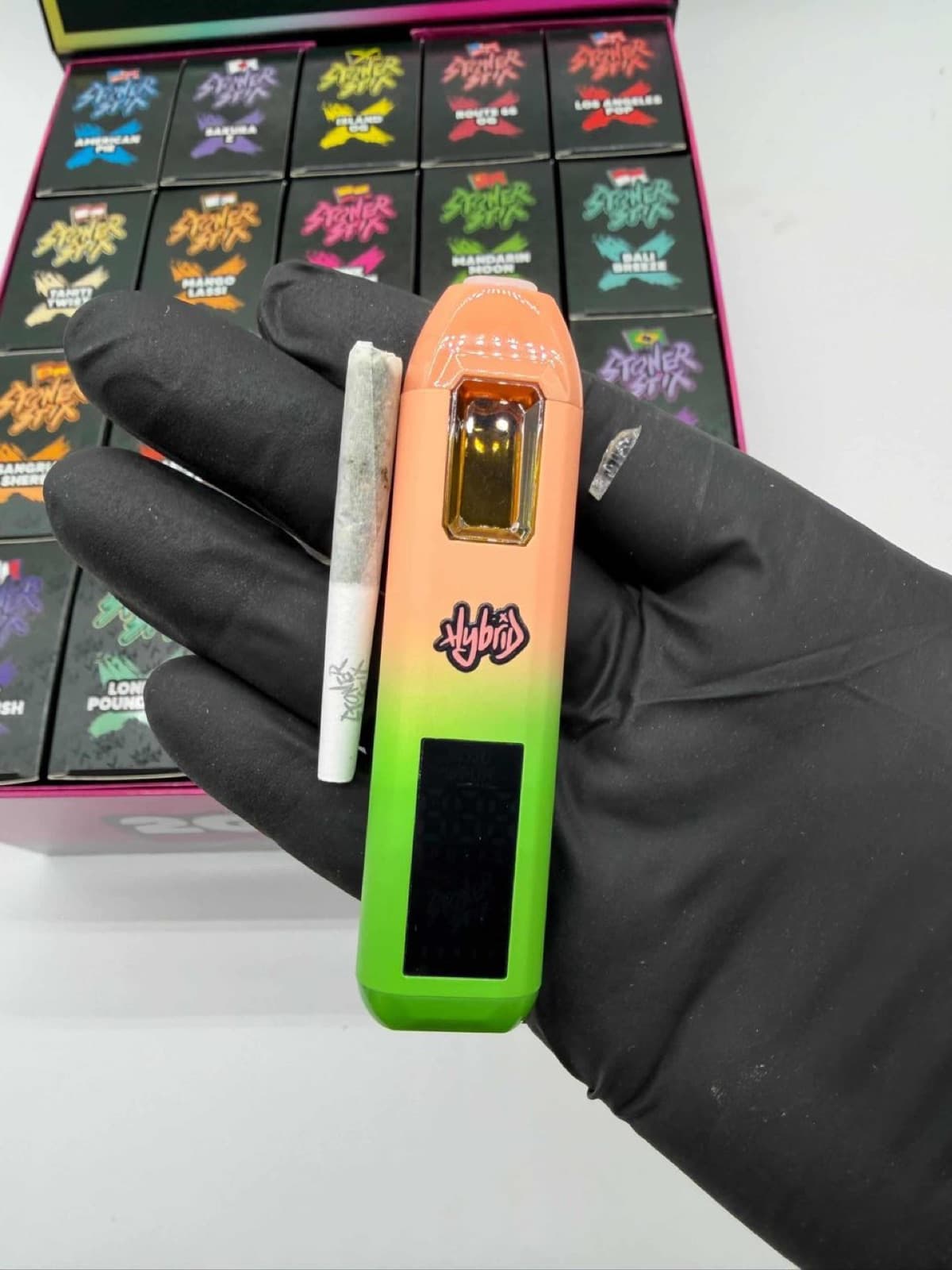 Stoner Stix peach and green device with joint