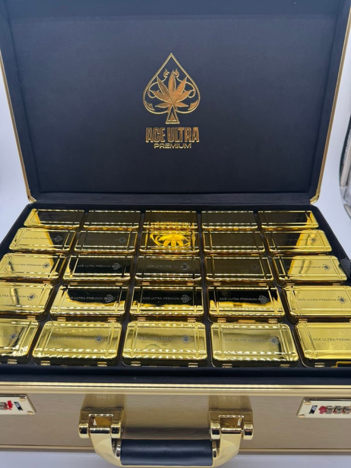 Ace Ultra Premium gold briefcase filled with gold tins