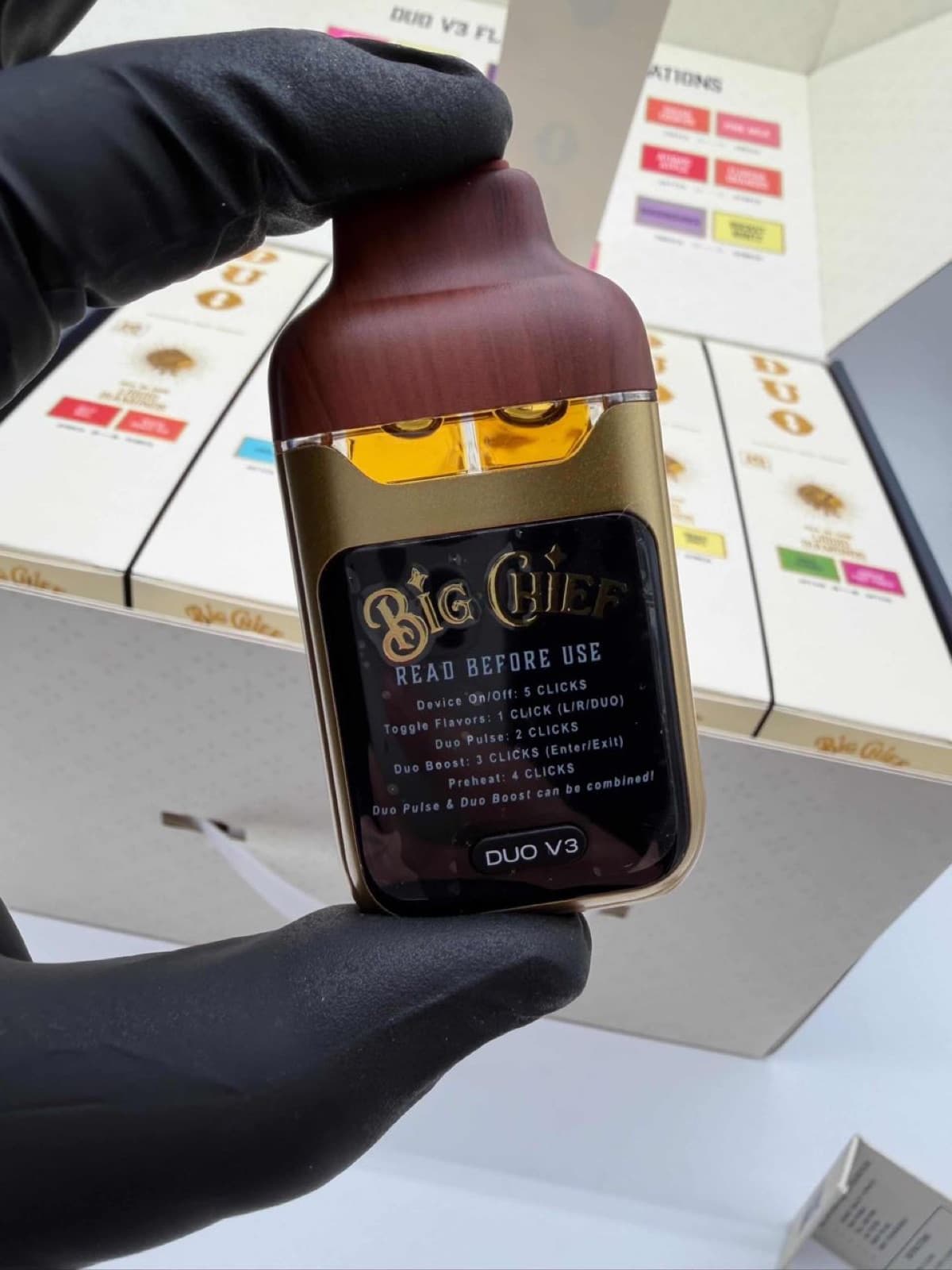 Big Chief Duo V3 woodgrain device held in hand