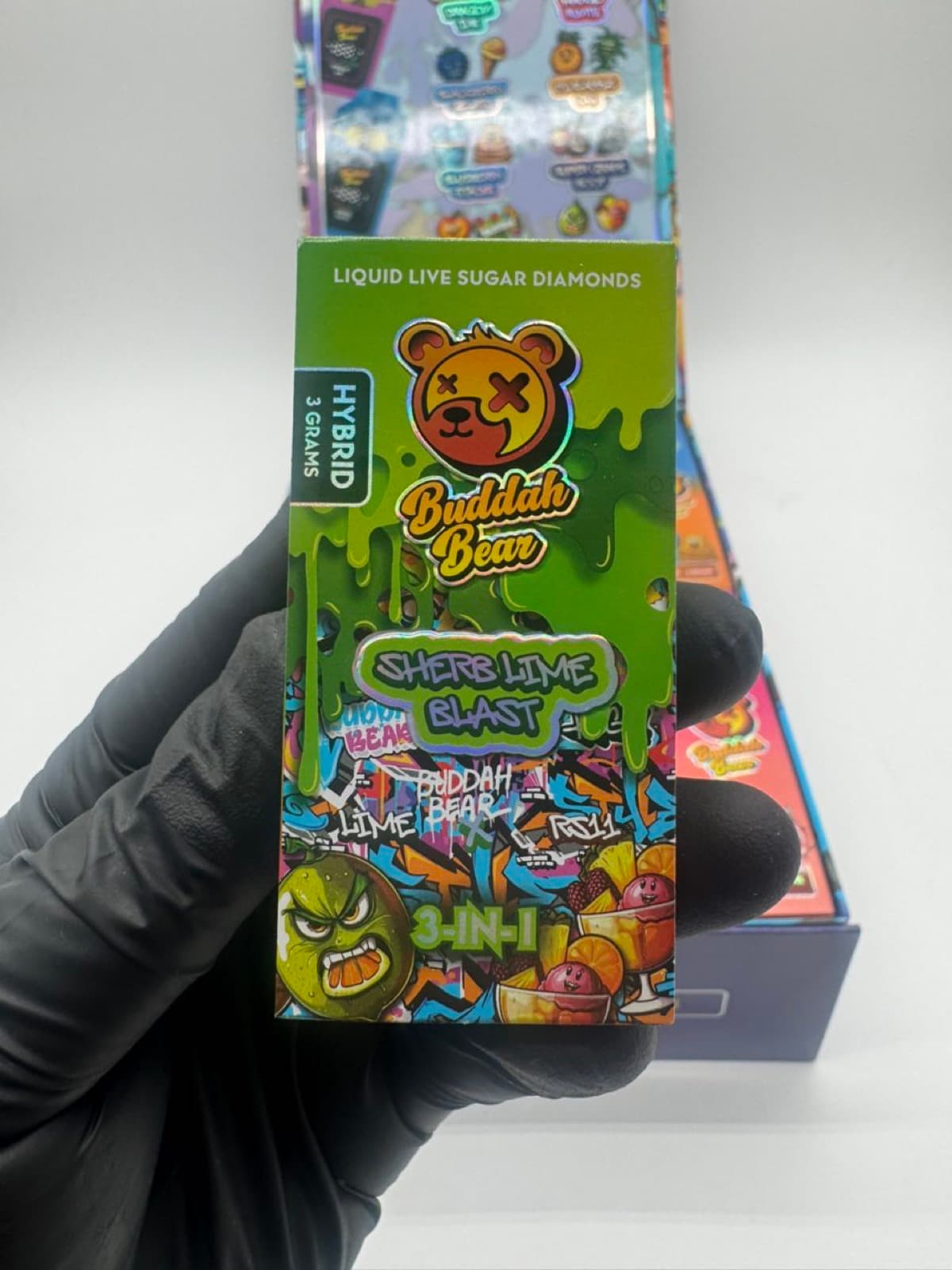 Buddah Bear Sherb Lime Blast box held in hand