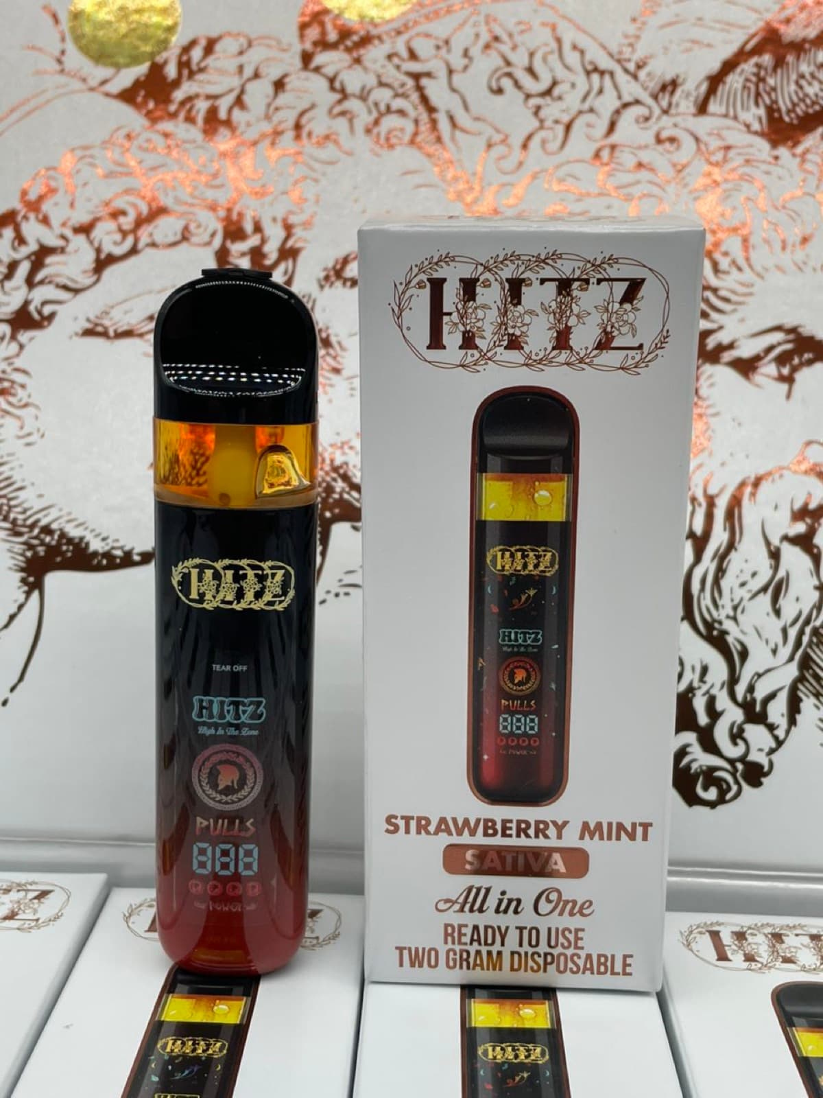 Hitz Strawberry Mint device standing beside its box