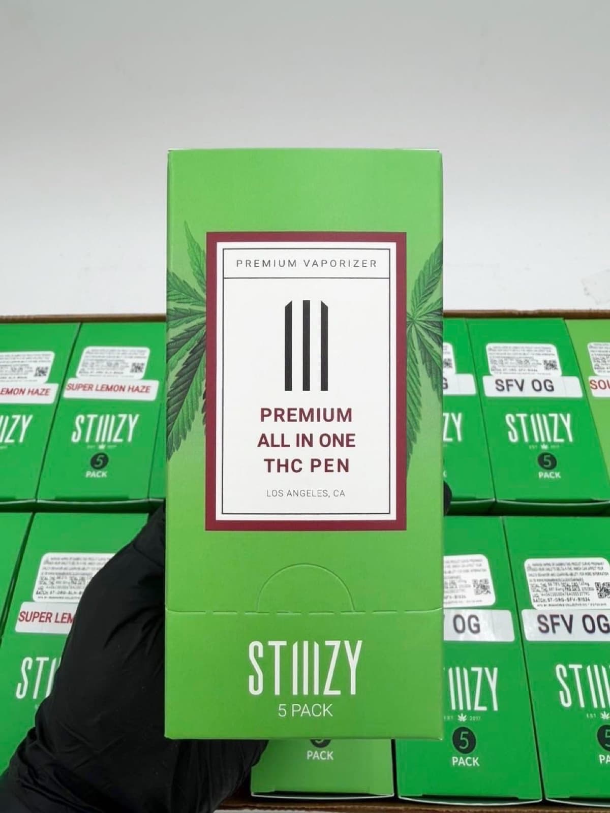 Stiiizy premium all-in-one THC pen 5-pack box held in hand
