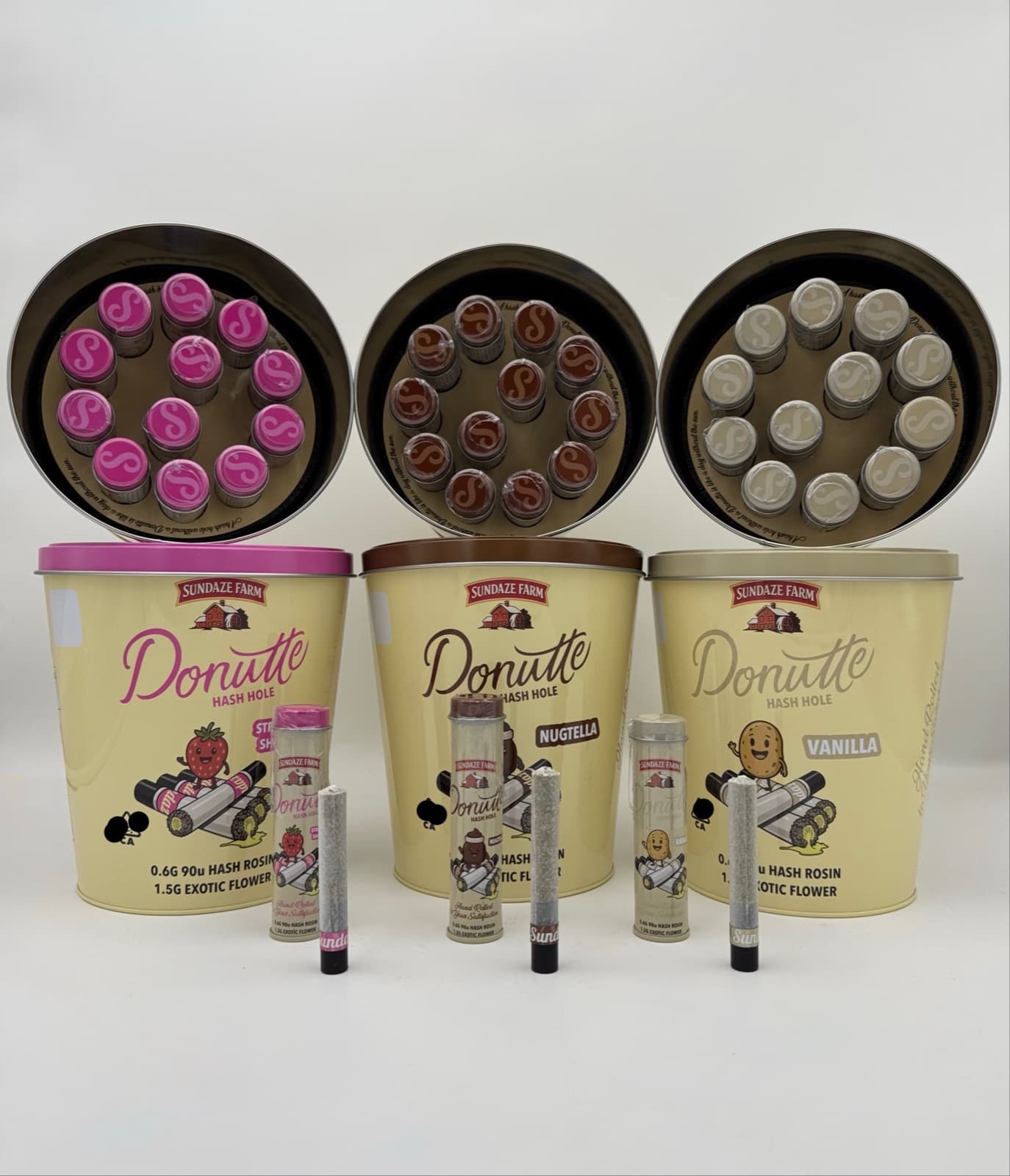Three Donutte Hash Hole tins in Strawberry, Nugtella, Vanilla