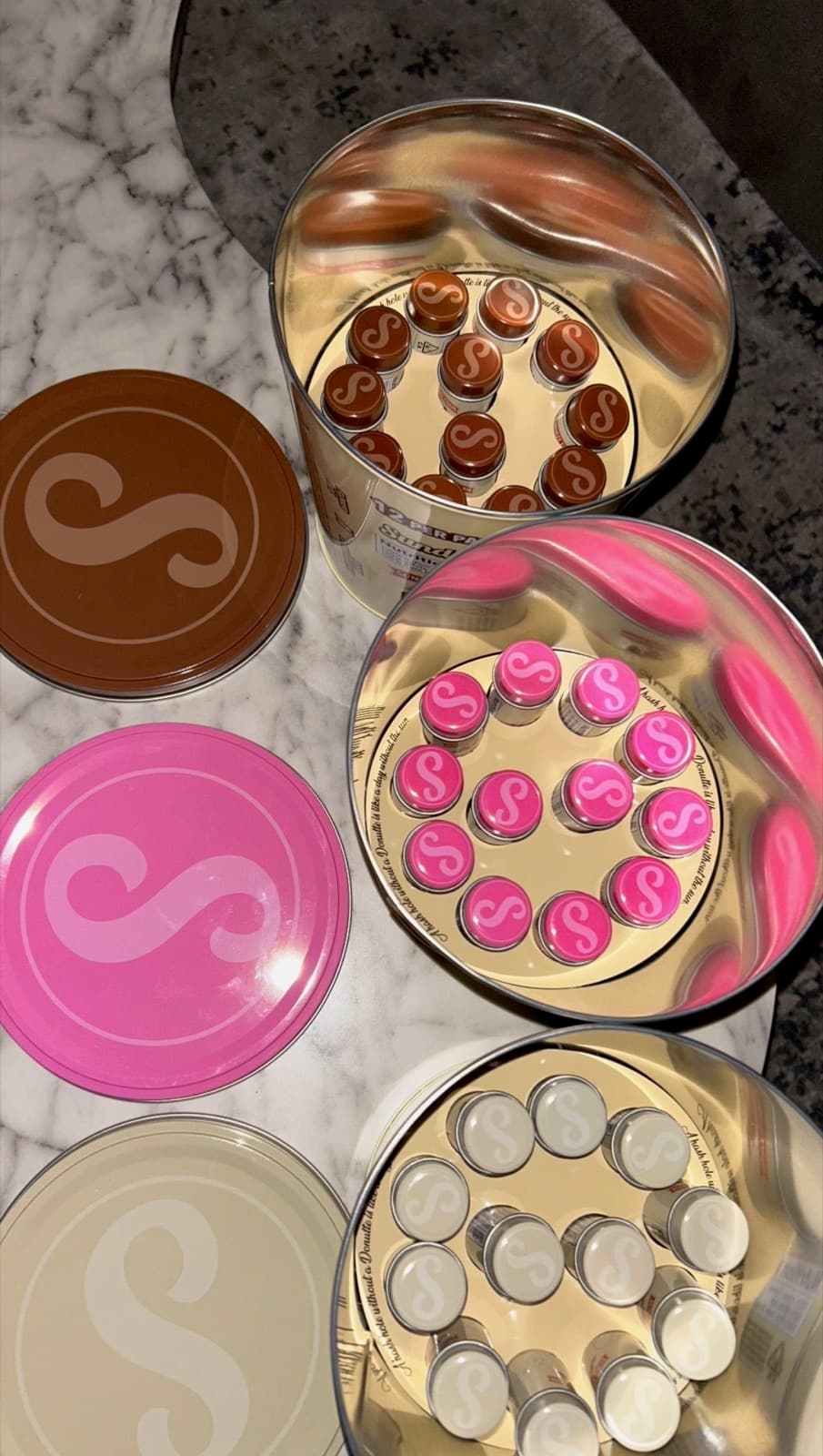 Open Donutte tins showing tubes from above