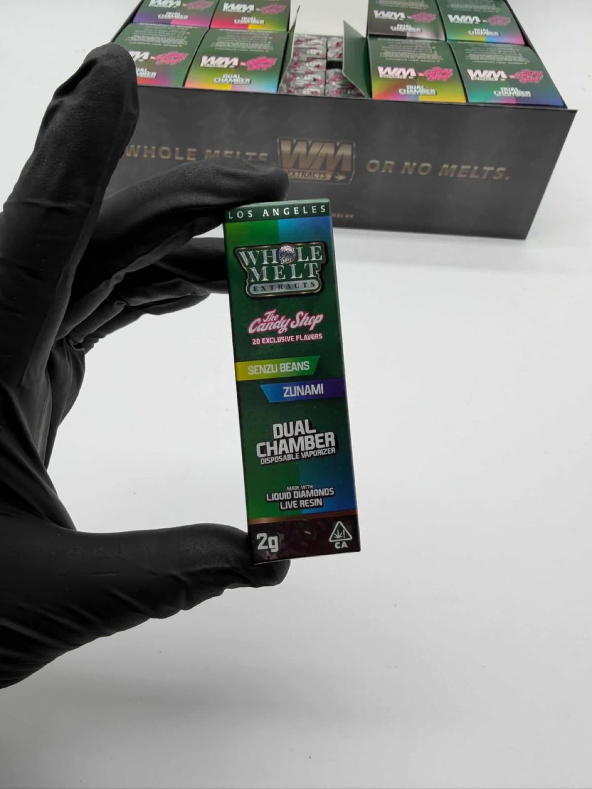 Whole Melt Zunami dual chamber box held in hand